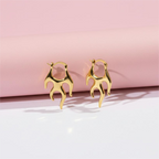Designer gold tone flame earrings Shadowborne